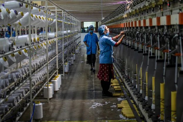 female_factory_worker_machinery