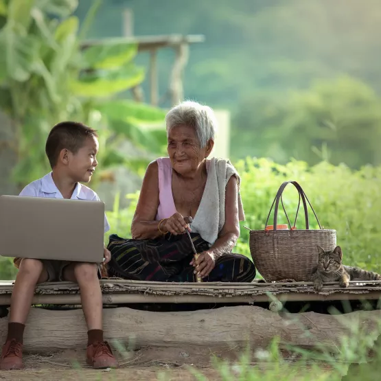 boy_laptop_grandma_outside_access_technology-scaled