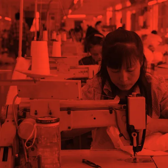 woman_sewing_in_factory_red