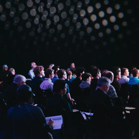 A group of people in a conference room