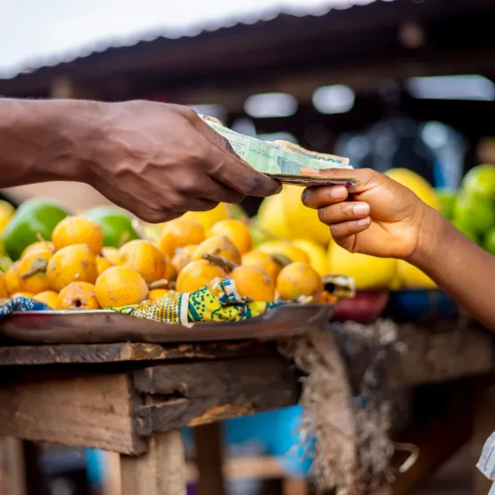 Hands-paying-market-fruit-colourful-cash
