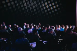 A group of people in a conference room
