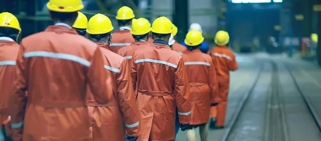 group_of_factory_workers_safety_helmets_cropped