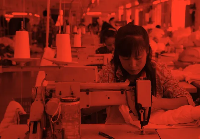 woman_sewing_in_factory_red