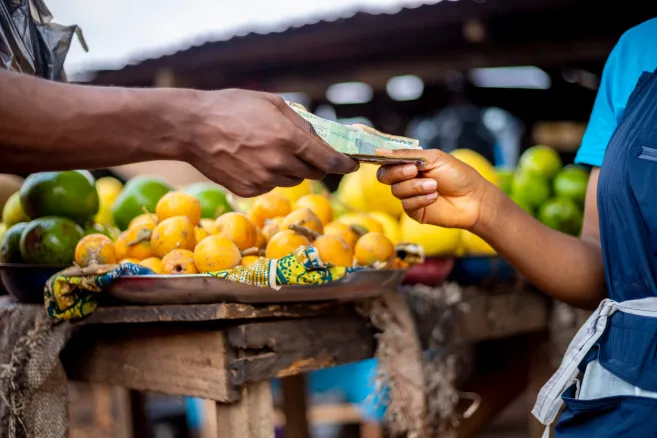 Hands-paying-market-fruit-colourful-cash