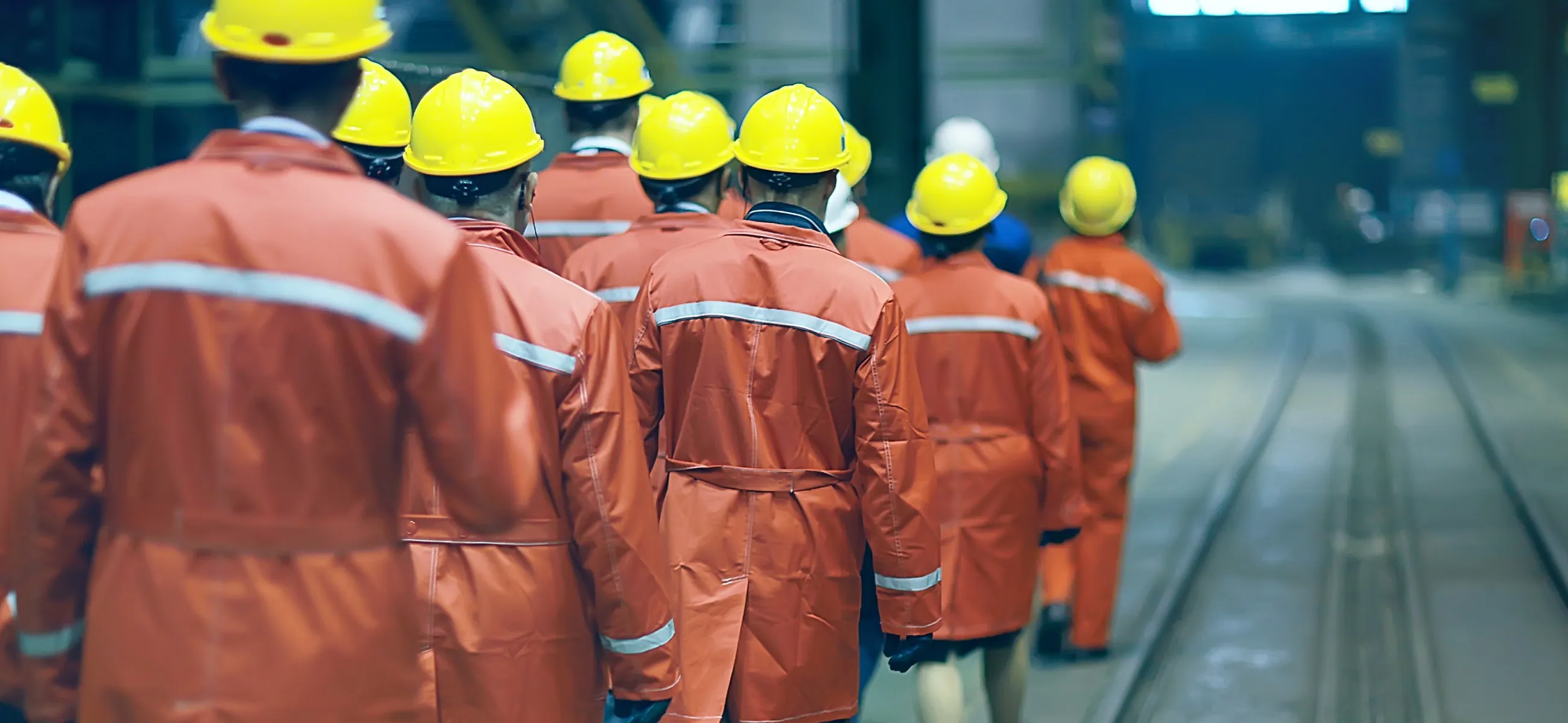 group_of_factory_workers_safety_helmets_cropped