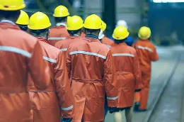 group_of_factory_workers_safety_helmets_cropped