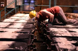 man_working_safety_helmet_fixing_machine